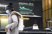 The electronic ticker display outside the Toronto Stock Exchange Tower in Toronto, is photographed after the market closed on Monday, Jan., 24.