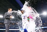 TORONTO, ON - SEPTEMBER 08:  Bo Bichette #11 of the Toronto Blue Jays is doused with water by Vladimir Guerrero Jr. #27 following a win against the Kansas City Royals at Rogers Centre on September 08, 2023 in Toronto, Ontario, Canada.  (Photo by Vaughn Ridley/Getty Images)