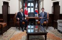Canadian Prime Minister Justin Trudeau and South Korean President Yoon Suk Yeol are seen before a meeting in his office on Parliament Hill, in Ottawa, Friday, Sept. 23, 2022. THE CANADIAN PRESS/Adrian Wyld