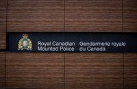 The RCMP logo is seen outside Royal Canadian Mounted Police "E" Division Headquarters, in Surrey, B.C., on Friday April 13, 2018. Saskatchewan RCMP are seeking tips after finding human remains in a landfill on a First Nation.THE CANADIAN PRESS/Darryl Dyck
