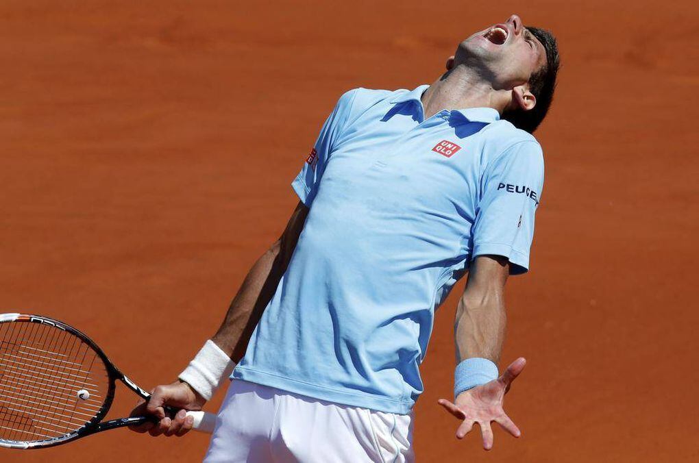 ...semi-final match against Ernests Gulbis of Latvia at the French Open ten...