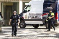 Members of the Waterloo Regional Police investigate a stabbing at the University of Waterloo, in Waterloo, Ont., Wednesday, June 28, 2023. Waterloo Regional Police said three victims were stabbed inside the university's Hagey Hall, with one person taken into custody. THE CANADIAN PRESS/Nick Iwanyshyn