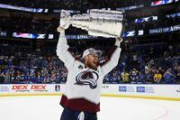 TAMPA, FLORIDA - JUNE 26: Gabriel Landeskog #92 of the Colorado Avalanche lifts the Stanley Cup after defeating the Tampa Bay Lightning 2-1 in Game Six of the 2022 NHL Stanley Cup Final at Amalie Arena on June 26, 2022 in Tampa, Florida. (Photo by Bruce Bennett/Getty Images)