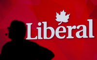 A Liberal Party of Canada logo is shown on a giant screen as a technician looks on during day one of the party's biennial convention in Montreal, Thusday, Feb. 20, 2014. The federal Liberals are touting what they call their best fundraising quarter in the party's history. THE CANADIAN PRESS/Graham Hughes