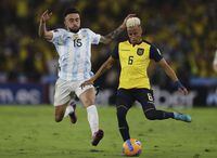 Ecuador's Byron Castillo, right, is challenged by Argentina's Nicolas Gonzalez during a qualifying soccer match for the FIFA World Cup Qatar 2022 at Monumental Banco Pichincha stadium in Guayaquil, Ecuador, Tuesday, March 29, 2022. (Jose Jacome/Pool via AP)

                                                                                                                                                                                 
