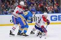 ST LOUIS, MO - DECEMBER 11: Ben Chiarot #8 and Kale Clague #58 both of the Montreal Canadiens defend against Brandon Saad #20 of the St. Louis Blues during the third period at Enterprise Center on December 11, 2021 in St Louis, Missouri. (Photo by Dilip Vishwanat/Getty Images)
