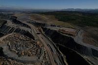FILE PHOTO: The edge of Glencore's Mount Owen coal mine and adjacent rehabilitated land are pictured in Ravensworth, Australia, June 21, 2022. Picture taken June 21, 2022. Picture taken with a drone.  REUTERS/Loren Elliott/File Photo