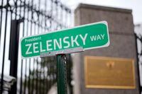 A sign that reads "President ZELENSKY WAY" is seen in front of the Embassy of Russian Federation, Monday, March 7, 2022 in Washington. (AP Photo/Carolyn Kaster)