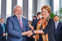 This handout picture released by the Brazilian Presidency shows Brazilian President Luiz Inacio Lula da Silva (L) and Brazilian former President (2011-2016) Dilma Rousseff (R) shaking hands after Rousseff took office as the new President of the New Development Bank (NDB) in Shanghai, China on April 13, 2023. (Photo by Ricardo STUCKERT / Brazilian Presidency / AFP) / RESTRICTED TO EDITORIAL USE - MANDATORY CREDIT "AFP PHOTO / BRAZILIAN PRESIDENCY / RICARDO STUCKERT" - NO MARKETING NO ADVERTISING CAMPAIGNS - DISTRIBUTED AS A SERVICE TO CLIENTS (Photo by RICARDO STUCKERT/Brazilian Presidency/AFP via Getty Images)