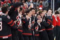 Canada celebrates their 6-2 victory over Sweden following the Hlinka Gretzky Cup gold medal game in Edmonton on Saturday, August 11, 2018.&nbsp; Hockey Canada has announced Stephane Julien will lead its men's under-18 team at the upcoming Hlinka Gretzky Cup. THE CANADIAN PRESS/Codie McLachlan