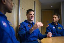 Canadian Space Agency astronaut Jeremy Hansen, centre, participates in interviews with fellow members of the Artemis II crew, NASA astronauts Victor Glover, left, Reid Wiseman, right, and Christina Hammock Koch, not shown, at the U.S. Embassy in Ottawa, Tuesday, April 25, 2023. THE CANADIAN PRESS/Justin Tang