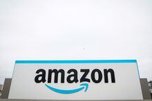 FILE PHOTO: The Amazon logo is displayed on a sign outside the company's LDJ5 sortation center, as employees begin voting to unionize a second warehouse in the Staten Island borough of New York City, U.S. April 25, 2022.  REUTERS/Brendan McDermid./File Photo