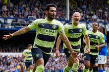 Manchester City's Ilkay Gundogan celebrates after scoring his side's opening goal during the English Premier League soccer match between Everton and Manchester City at the Goodison Park stadium in Liverpool, England, Sunday, May 14, 2023. (AP Photo/Jon Super)