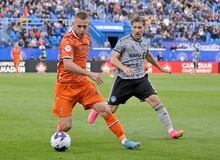 May 24, 2023; Montreal, Quebec, CAN; CF Montreal midfielder Matko Miljevic (8) defends against Forge FC defender Rezart Rama (24) during the first half at Stade Saputo. Mandatory Credit: Eric Bolte-USA TODAY Sports