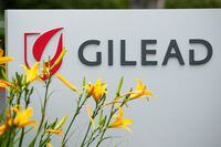 FILE PHOTO: The logo of Gilead Sciences Inc pharmaceutical company is seen in Oceanside, California, U.S., April 29, 2020. REUTERS/Mike Blake/File Photo
