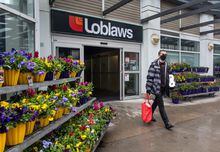 A shopper walking out of a Loblaws supermarket, is photographed on May 3, 2023. Minh Tuan Nguyen/ The Globe and Mail
