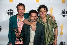 Arkells pose with an award for Group of the year during the Juno Awards in Edmonton on Saturday, March 11, 2023. THE CANADIAN PRESS/Jason Franson
