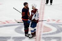 EDMONTON, ALBERTA - JUNE 06: Connor McDavid #97 of the Edmonton Oilers shakes hands with Gabriel Landeskog #92 of the Colorado Avalanche after Colorado defeated Edmonton 6-5 in overtime in Game Four of the Western Conference Final of the 2022 Stanley Cup Playoffs at Rogers Place on June 06, 2022 in Edmonton, Alberta. (Photo by Codie McLachlan/Getty Images)