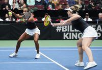 Canada's Leylah Fernandez, left, returns as she and Gabriela Dabrowski play Belgium's Kirsten Flipkens and Greet Minnen during a Billie Jean King Cup qualifiers doubles match, in Vancouver, on Saturday, April 15, 2023. THE CANADIAN PRESS/Darryl Dyck
