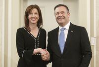 Premier Jason Kenney says Tanya Fir will become the minister for jobs, economy and innovation and continue to serve as the associate minister of red tape reduction. Kenney shakes hands with Fir at a cabinet swearin-in Edmonton on Tuesday April 30, 2019. THE CANADIAN PRESS/Jason Franson
