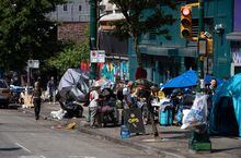 Tents line the sidewalk on East Hastings Street, Vancouver, on Tuesday, Aug. 9, 2022. The city began clearing the encampment in the Downtown Eastside on Tuesday, but there was little difference to be seen the next day. THE CANADIAN PRESS/Darryl Dyck