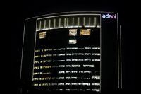 FILE PHOTO: The logo of the Adani Group is seen on the facade of its Corporate House on the outskirts of Ahmedabad, India, January 27, 2023. REUTERS/Amit Dave/File Photo
