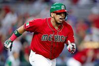 MIAMI, FLORIDA - MARCH 17: Issac Paredes #17 of Team Mexico reacts after hitting a RBI single during the seventh inning against Team Puerto Rico in the World Baseball Classic Quarterfinals game at loanDepot park on March 17, 2023 in Miami, Florida. (Photo by Megan Briggs/Getty Images)