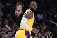 Los Angeles Lakers' LeBron James makes his way down the court after a basket against the Memphis Grizzlies during the first half in Game 6 of a first-round NBA basketball playoff series Friday, April 28, 2023, in Los Angeles. (AP Photo/Jae C. Hong)