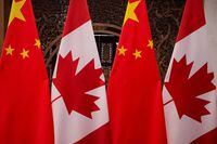 Picture of Canadian and Chinese flags taken prior to the meeting with Canada's Prime Minister Justin Trudeau and China's President Xi Jinping at the Diaoyutai State Guesthouse on December 5, 2017, in Beijing. Picture taken December 5, 2017. Fred Dufour/Pool via REUTERS