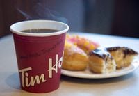 Tim Hortons says it its taking its coffee, doughnuts and Timbits to India. The coffee chain says it will open its first location in the country later this year as part of an agreement with a joint venture owned by Apparel Group and Gateway Partners. A coffee and doughnut from Tim Hortons is seen at a Coquitlam, B.C., location on April 26, 2018. THE CANADIAN PRESS/Jonathan Hayward