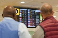 People look at arrivals board in Heathrow Terminal 3 in London, Britain, August 22, 2023. REUTERS/Maja Smiejkowska