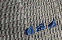 FILE PHOTO: European Union flags flutter outside the European Commission headquarters in Brussels, Belgium, March 24, 2021. REUTERS/Yves Herman/File Photo
