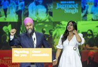 NDP Leader Jagmeet Singh and his wife Gurkiran Kaur Sidhu arrive on stage during the Canadian federal election in Vancouver, Monday, September 20, 2021. THE CANADIAN PRESS/Jonathan Hayward