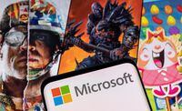 FILE PHOTO: Microsoft logo is seen on a smartphone placed on displayed Activision Blizzard's games characters in this illustration taken January 18, 2022. REUTERS/Dado Ruvic/Illustration