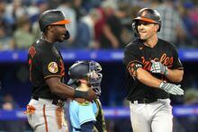 Baltimore Orioles' Adam Frazier (right) celebrates his two-run home run against the Toronto Blue Jays with Jorge Mateo during ninth inning American League MLB baseball action in Toronto on Friday, May 19, 2023. THE CANADIAN PRESS/Chris Young