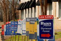 FILE PHOTO: Real estate signs advertise new homes for sale in multiple new developments in York County, South Carolina, U.S., February 29, 2020. REUTERS/Lucas Jackson/File Photo