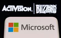 FILE PHOTO: Microsoft logo is seen on a smartphone placed on displayed Activision Blizzard logo in this illustration taken January 18, 2022. REUTERS/Dado Ruvic/Illustration