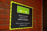 FILE PHOTO: A signage of Jobcentre Plus is pictured, following the outbreak of the coronavirus disease (COVID-19), in Chester, Britain August 11, 2020. REUTERS/Jason Cairnduff/File Photo