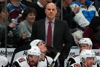 Arizona Coyotes head coach Rick Tocchet, center top, looks on in the second period of an NHL hockey game  against the Colorado Avalanche, Friday, March 29, 2019, in Denver. (AP Photo/David Zalubowski)