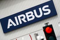 FILE PHOTO: The logo of Airbus is pictured at the entrance of the Airbus facility in Bouguenais, near Nantes, France, July 2, 2020. REUTERS/Stephane Mahe/File Photo