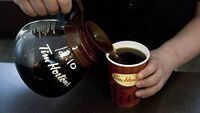 A cup of Tim Hortons coffee is poured in Toronto on May 14, 2010.