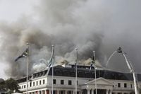 Smoke rises from the Parliament in Cape Town, South Africa, Monday, Jan 3, 2022 after the fire re-ignited late afternoon. Firefighters are again on the scene after a major blaze tore through the precinct a day earlier. (AP Photo/Nardus Engelbrecht)
