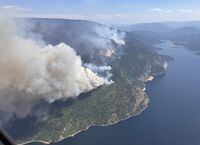 The Lower East Adams Lake wildfire in B.C.'s Shuswap region is shown in a handout photo. Dozens more properties in the B.C. interior were placed on evacuation alert Monday as the Bush Creek East wildfire near Adams Lake fills the air with thick smoke. THE CANADIAN PRESS/HO-BC Wildfire Service **MANDATORY CREDIT**