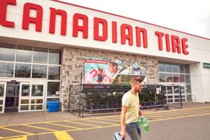 Customers outside a Canadian Tire store in Toronto, on Aug. 10, 2023.