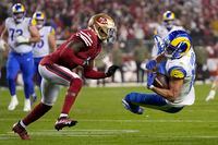 Los Angeles Rams wide receiver Cooper Kupp, right, is tackled in front of San Francisco 49ers cornerback Emmanuel Moseley during the second half of an NFL football game in Santa Clara, Calif., Monday, Nov. 15, 2021. (AP Photo/Tony Avelar)