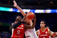 MANILA, PHILIPPINES - SEPTEMBER 08: RJ Barrett #9 of Canada drives to the basket against Nikola Milutinov #33 of Serbia in the fourth quarter during the FIBA Basketball World Cup semifinal game at Mall of Asia Arena on September 08, 2023 in Manila, Philippines. (Photo by Yong Teck Lim/Getty Images)