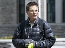 Hassan Diab leaves a vigil with supporters, Friday, April 21, 2023 in Ottawa. THE CANADIAN PRESS/Adrian Wyld