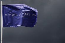 FILE PHOTO: A flag with the logo of Stellantis is seen at the company's corporate office building in Saint-Quentin-en-Yvelines near Paris, France, May 5, 2021. REUTERS/Gonzalo Fuentes/File Photo/File Photo
