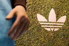 An Adidas logo is displayed at a retail store in Paramus, N.J., Tuesday, Oct. 25, 2022. Adidas has ended its partnership with the rapper formerly known as Kanye West over his offensive and antisemitic remarks, the latest company to cut ties with Ye and a decision that the German sportswear company said would hit its bottom line. (AP Photo/Seth Wenig)