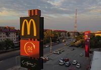 A sign with the logo is on display outside a McDonald's restaurant in Omsk, Russia May 18, 2022. Picture taken with a drone. REUTERS/Alexey Malgavko